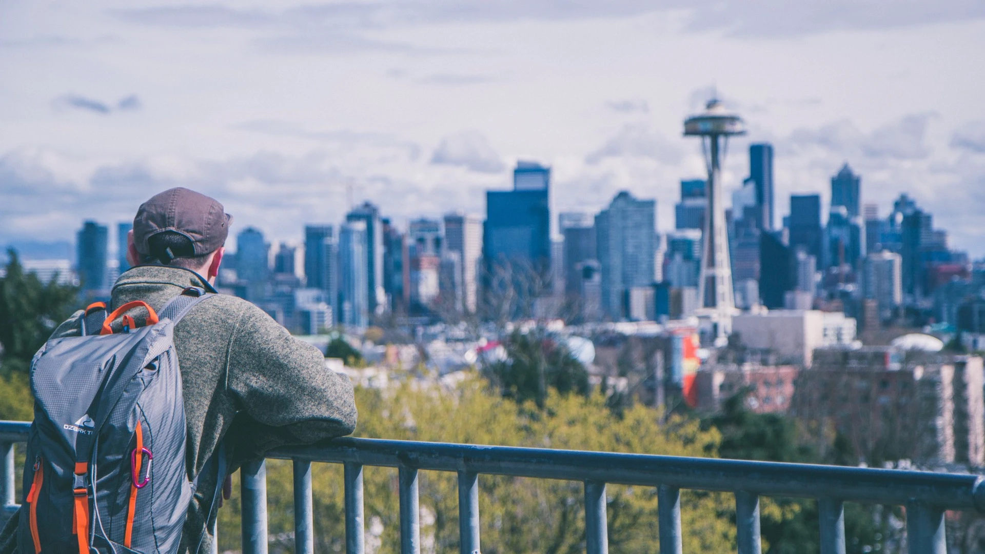 A man looks at the Seattle skyline