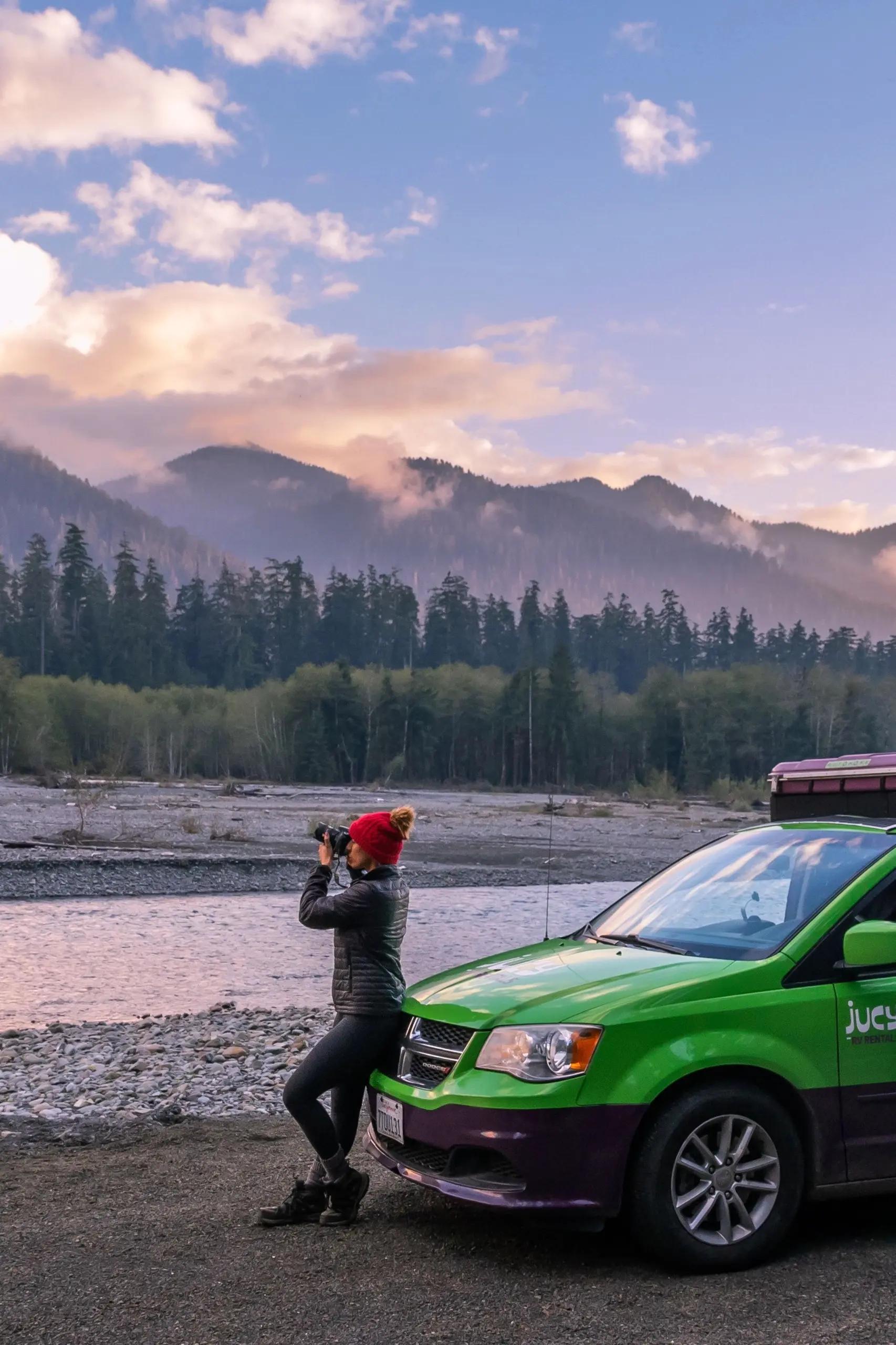 A woman is taking pictures of the nature.