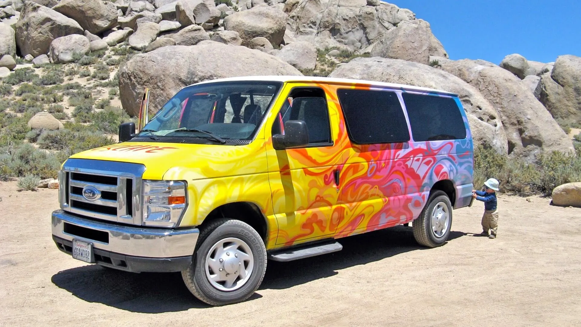 Escape Campervan and small child in the desert