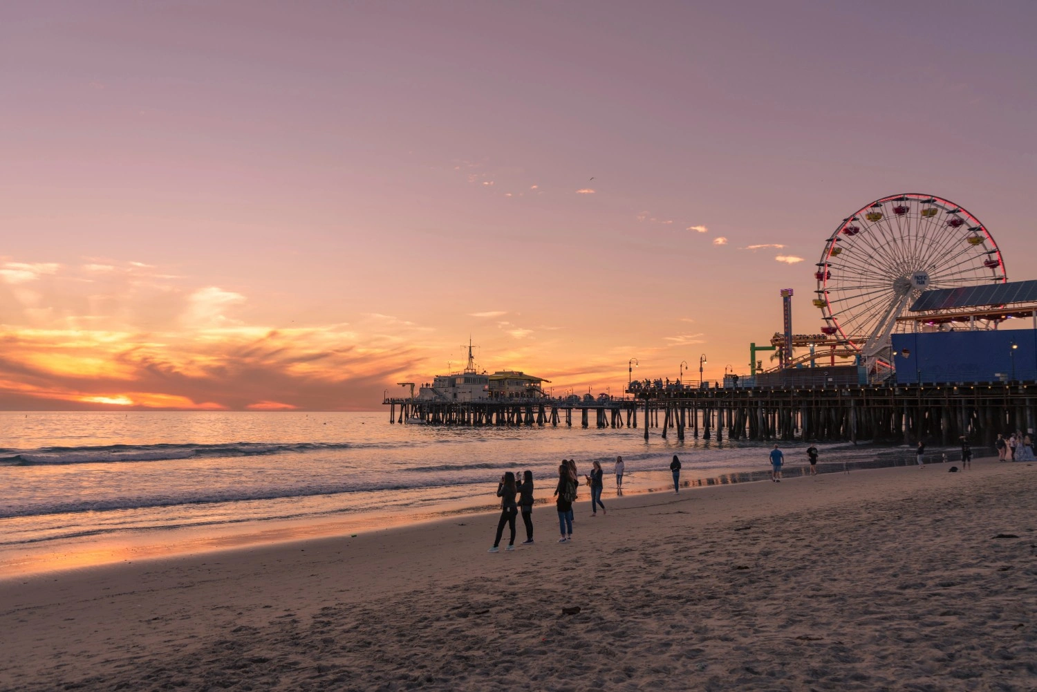 A scenic view of the Santa Monica Pier at sunset.