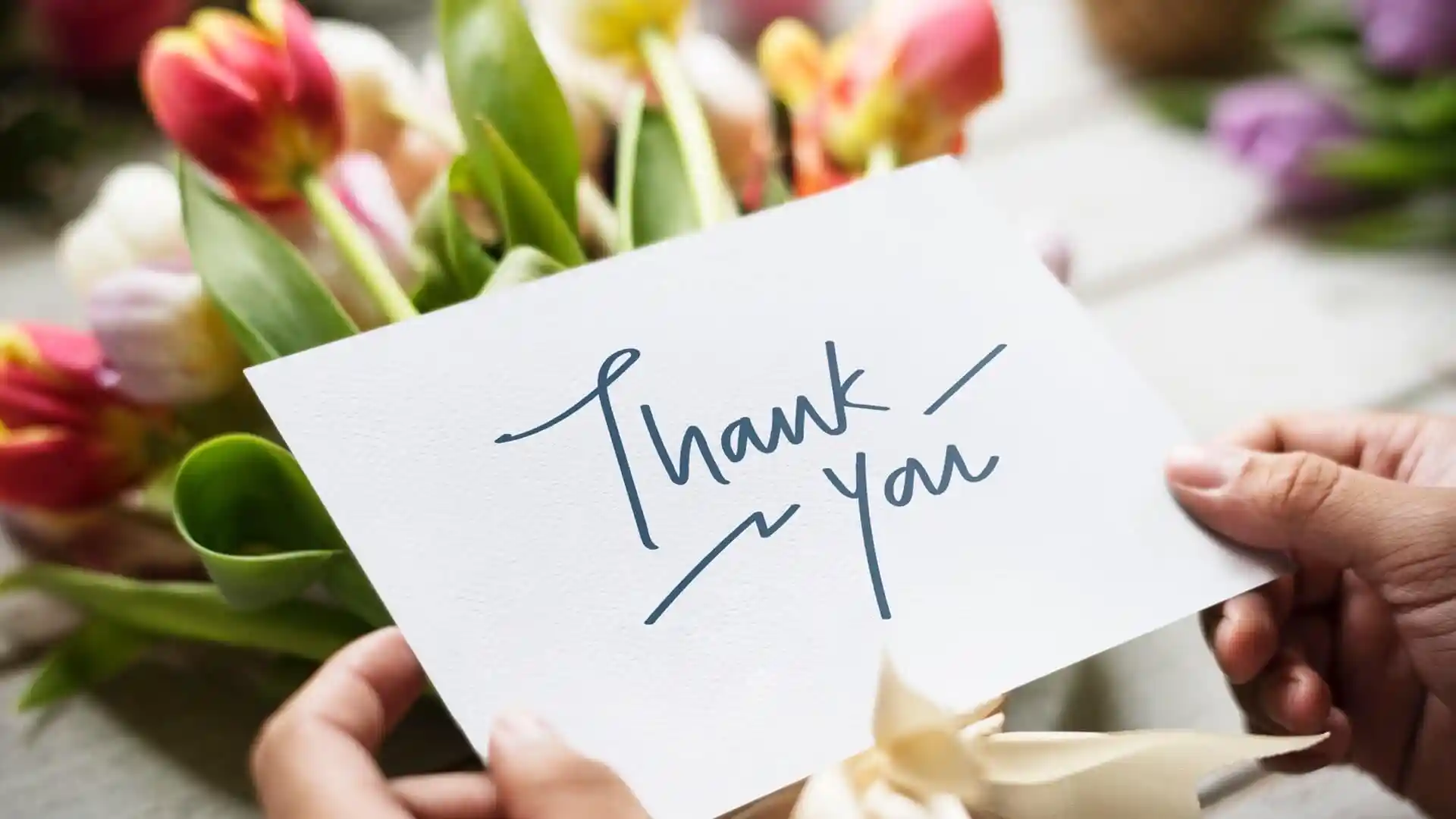 Thank you card with flowers in the background